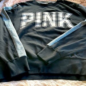 Pink Black with silver metallic stripes down each arm and the letters in PINK